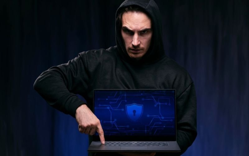 Cyber Security learner reviewing a protected laptop